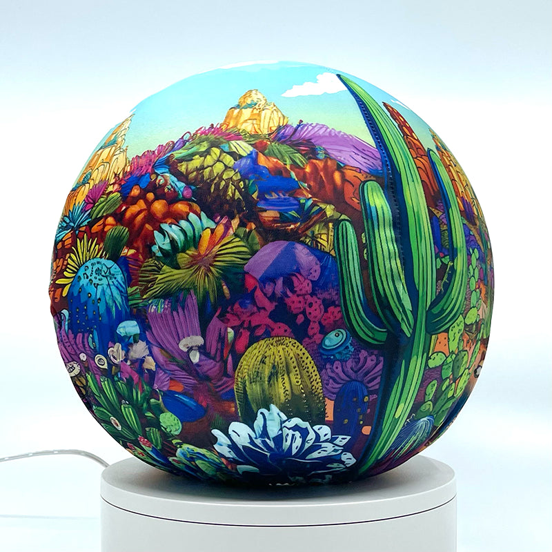 Fabric sphere cover with a colorful cactus doodle design, wrapped around a 8.7" soccer ball, 9.5" basketball ball, or a 10" globe.