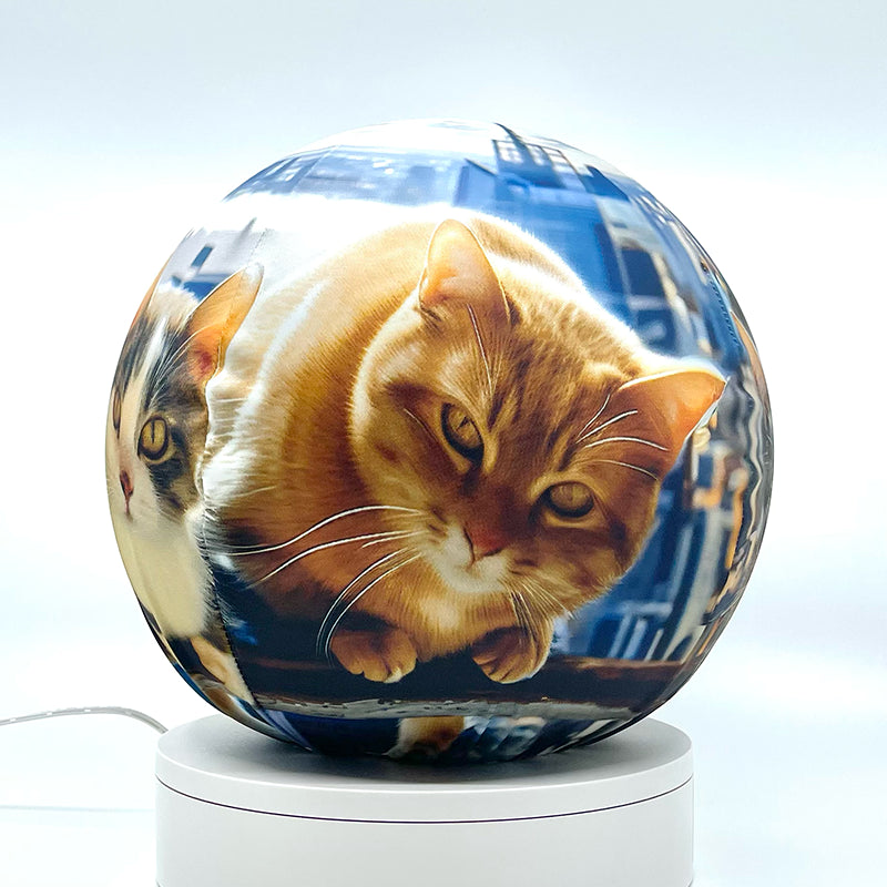 Fabric sphere cover featuring six cats atop a skyscraper design, wrapped around a 8.7" soccer ball, 9.5" basketball ball, or a 10" globe.