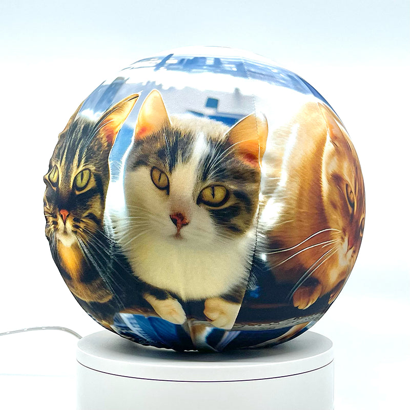 Fabric sphere cover featuring six cats atop a skyscraper design, wrapped around a 8.7" soccer ball, 9.5" basketball ball, or a 10" globe.