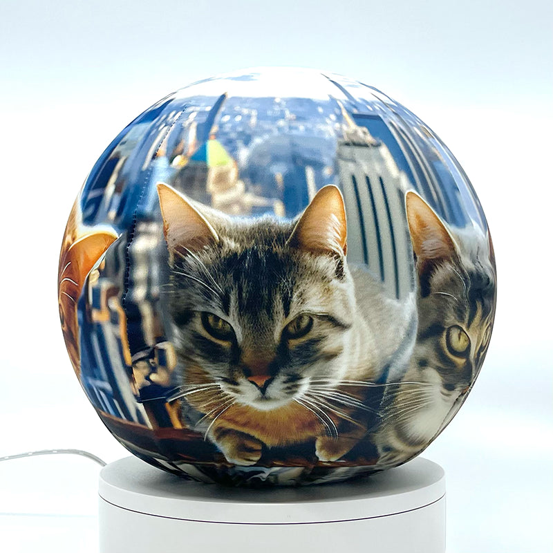 Fabric sphere cover featuring six cats atop a skyscraper design, wrapped around a 8.7" soccer ball, 9.5" basketball ball, or a 10" globe.