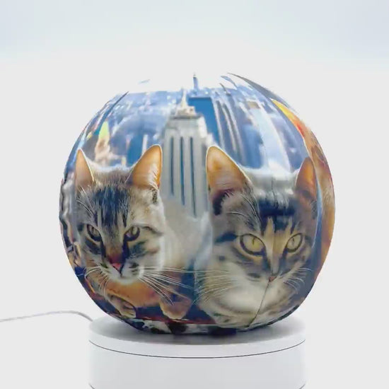 360°-rotating fabric sphere cover featuring six cats atop a skyscraper design, wrapped around a 8.7" soccer ball, 9.5" basketball ball, or a 10" globe.