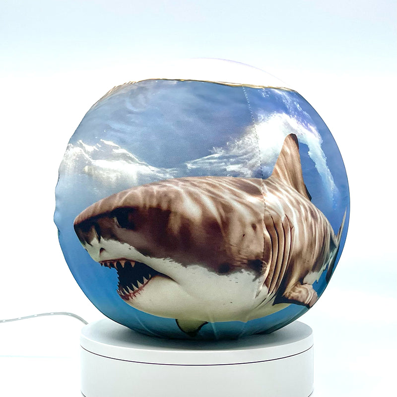 Fabric sphere cover depicting two sharks swimming, wrapped around a 8.7" soccer ball, 9.5" basketball ball, or a 10" globe.