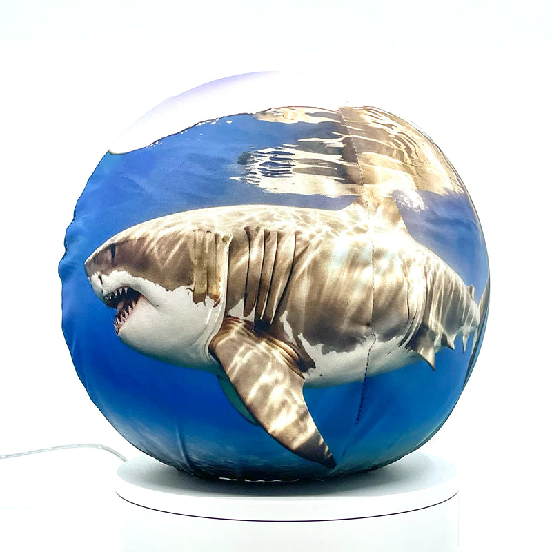 Fabric sphere cover depicting two sharks swimming, wrapped around a 8.7" soccer ball, 9.5" basketball ball, or a 10" globe.